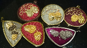 Acorn design brooches and pendants